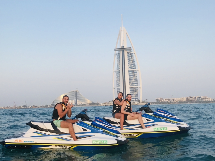 customers during a jet ski stop in front of the Burj Al Arab